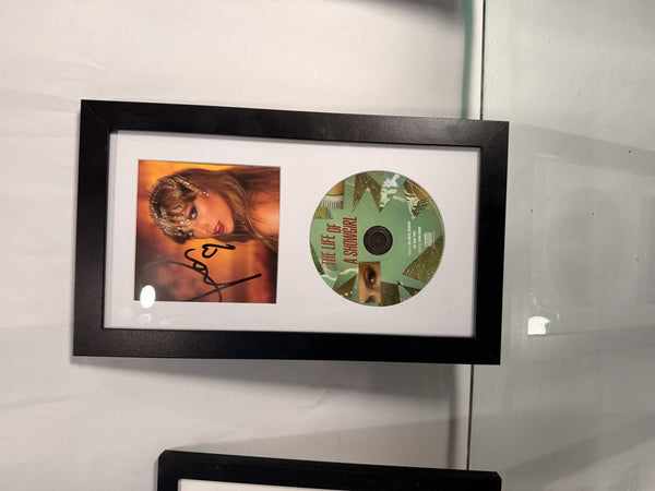 Taylor Swift The Life of a Showgirl signed CD — framed display
